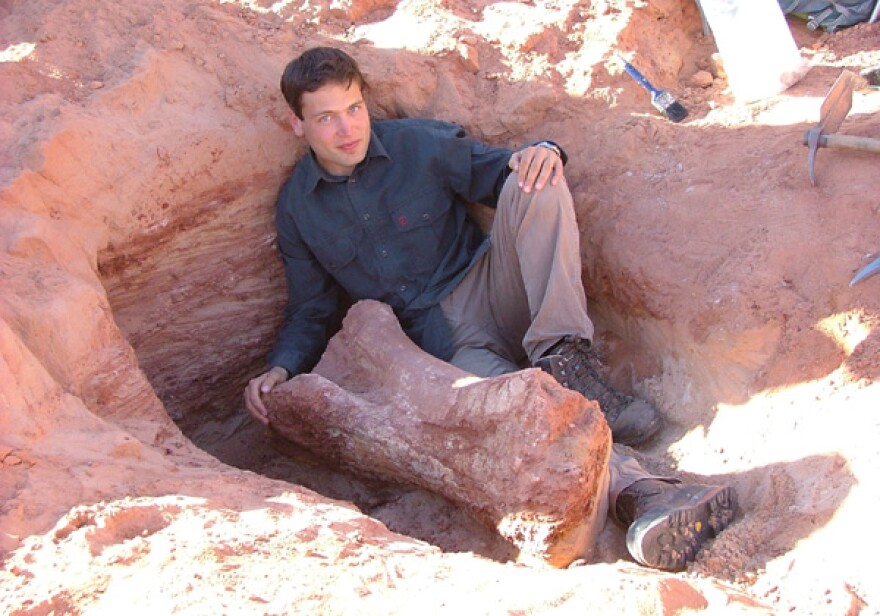 Nizar Ibrahim with a fossil.