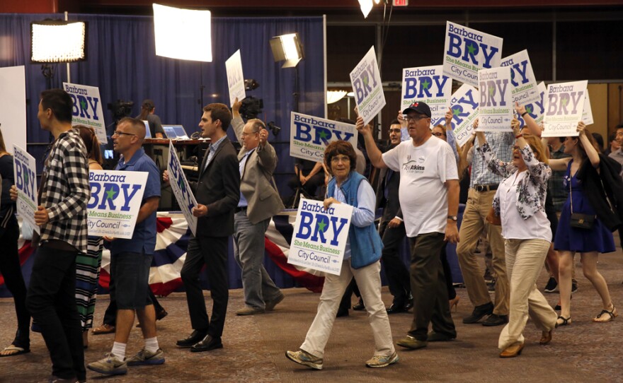 Supporters of Barbara Bry hold signs at Golden Hall in downtown San Diego, June 7, 2016. Bry will face Ray Ellis in a November runoff to represent District 1 on the San Diego City Council.