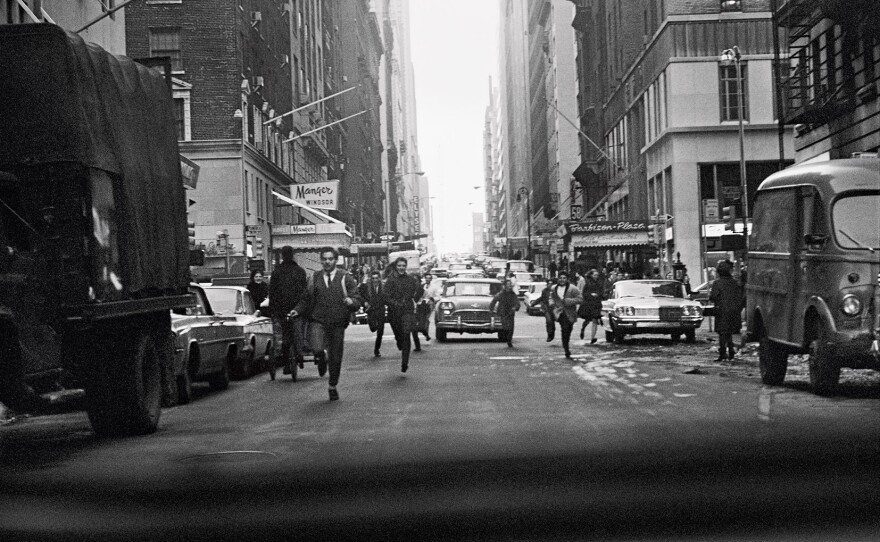 "The crowds chasing us in <em>A Hard Day's Night </em>were based on moments like this," McCartney writes. "Taken out of the back of our car on West Fifty-Eighth, crossing the Avenue of the Americas."