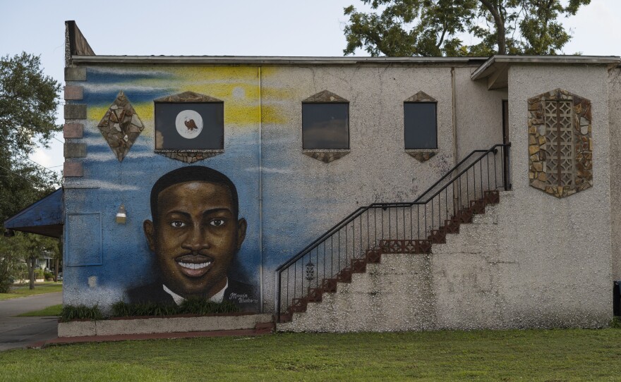 Memories - some visible and some hidden - are scattered around Brunswick, including this mural of Ahmaud Arbery.