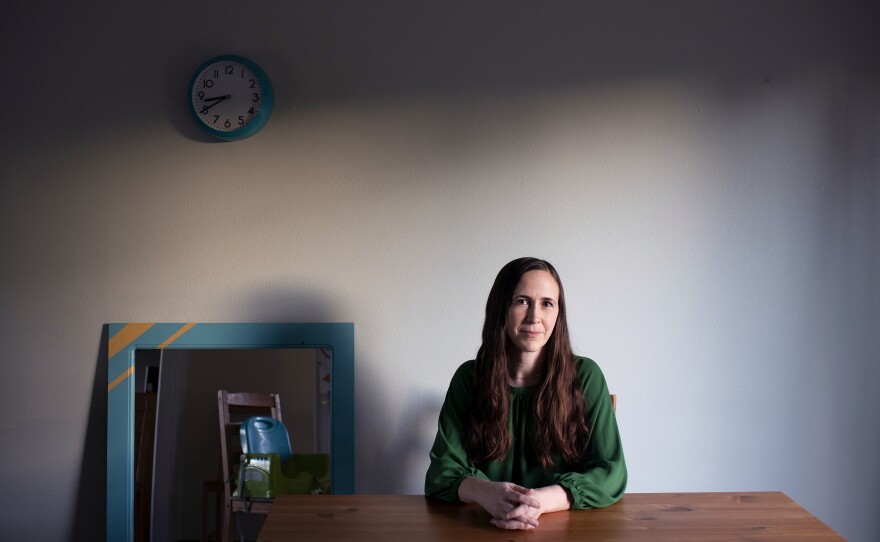 Bennett sits at the kitchen table at her home in Vancouver, Wash. Bennett, who has a master's of divinity, used to think chaplain work was "for extroverts or people who really like to pray ... and I just never saw myself that way."