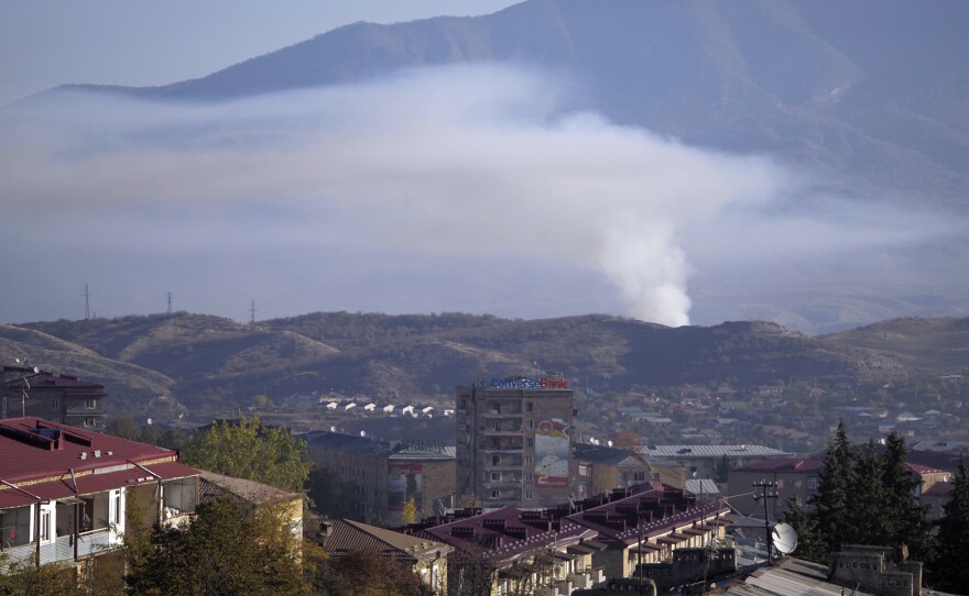 Smoke rises after shelling by Azerbaijan's artillery in Stepanakert, Nagorno-Karabakh, on Saturday.