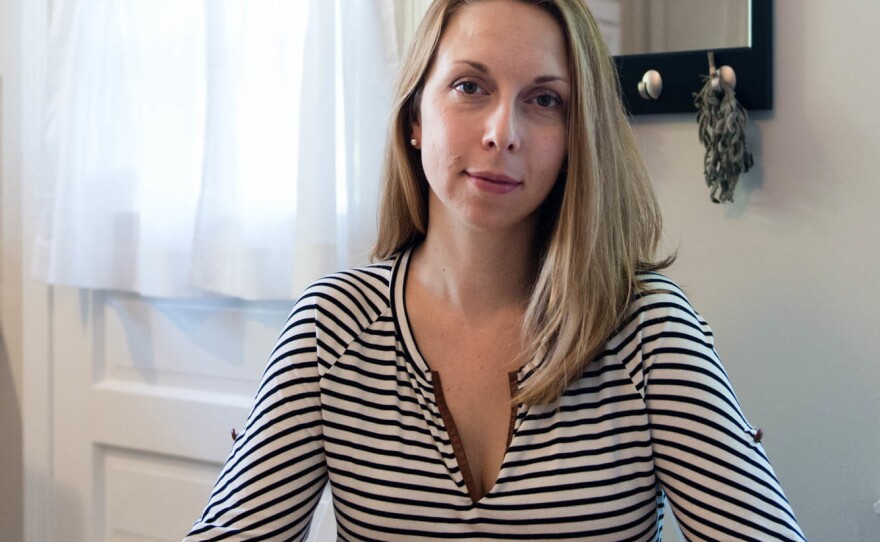 Meg Whitbeck, 34, at her home in Ridgefield, Conn. She says she is grateful for orphan drugs but torn on the issue of price. "Why can't they make it a little less expensive?" she asks. "What's holding them back?"