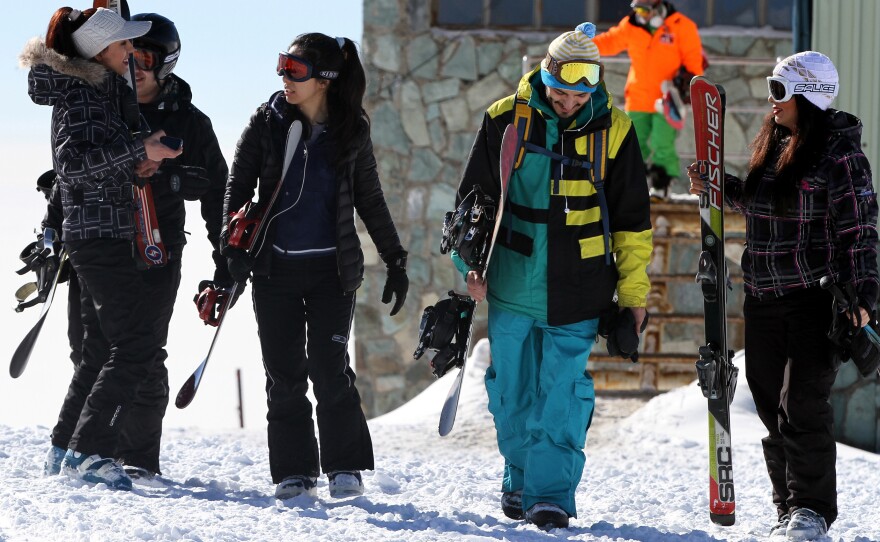 Skiers at a resort in the Alborz mountains near the capital Tehran in January. Men and women used to ski separately in Iran. In recent years, they have been skiing together, though it is not formally authorized.