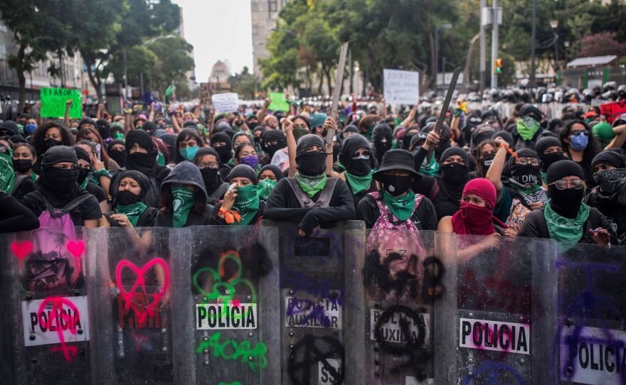 Supporters of the legalization of abortion clash with riot police during International Safe Abortion Day in Mexico City on September 28, 2020. Last year, Mexico's Supreme Court ruled that criminal penalties for abortion are unconstitutional.