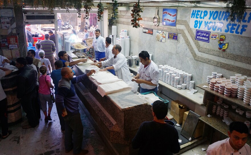 The assembly line set-up at Koshary Abou Tarek helps staff to keep up with the flood of orders at lunchtime.