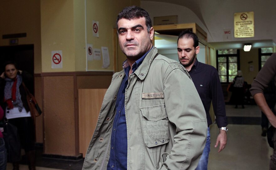 Journalist Kostas Vaxevanis waits to appear in court in Athens on Monday. Vaxevanis was arrested for the publication of 2,059 names of people alleged to have accounts in a Swiss bank.