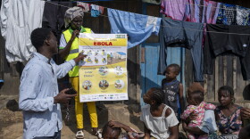 Eliezer Kasongo, president of REMEDE Bunia, raises awareness among residents about Ebola prevention measures during a community outreach event on Ebola Awareness Day in Bunia, Ituri Province, Democratic Republic of the Congo.