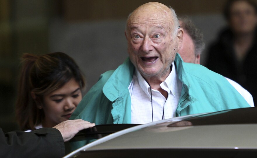 New York City Mayor Ed Koch says goodbye to reporters as he gets in his car after being released from a New York hospital on Dec. 12, 2012.