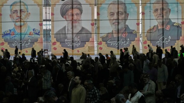 Iranian worshippers perform their Friday prayers under the portraits of the late Iranian Supreme Leader Ayatollah Ali Khamenei, second left, and top military officials who were killed during the U.S.-Israel campaign, at the Tehran University campus, in Tehran, Iran, Friday, April 24, 2026.