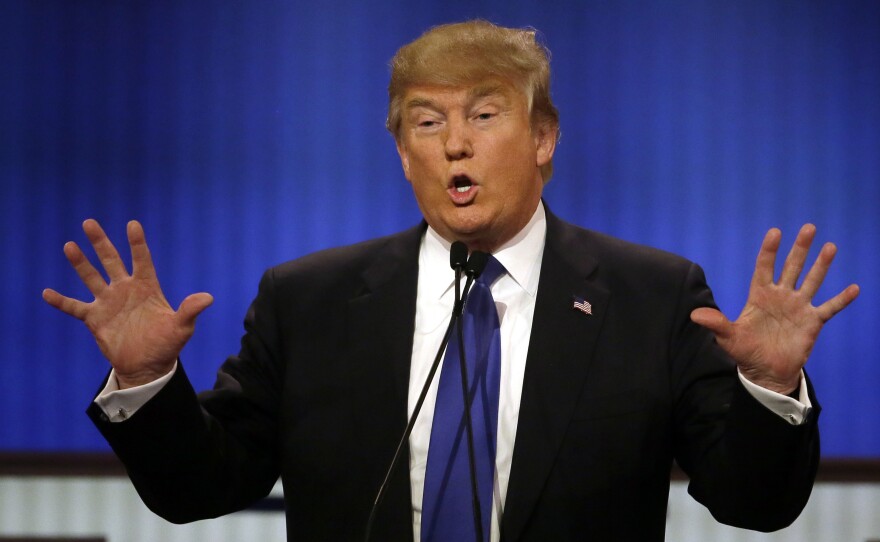 Donald Trump speaks during a Republican presidential primary debate in Detroit on Thursday.