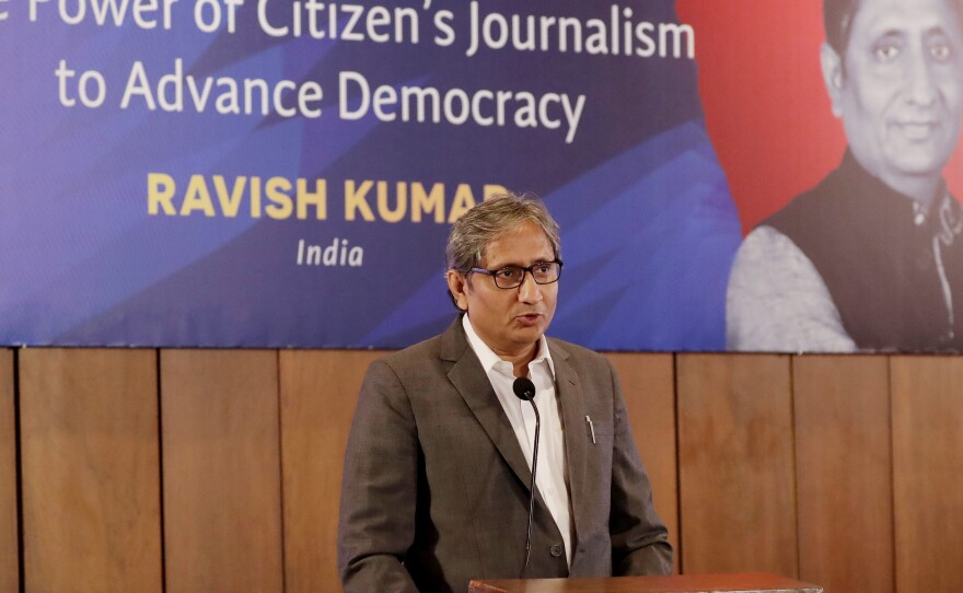 Indian journalist Ravish Kumar delivers a lecture on Sept. 6, 2019, in Manila, Philippines. Kumar, one of India's best-known TV figures, resigned from the NDTV channel after a business magnate with close ties to Prime Minister Narendra Modi, whose government has chipped away at press freedoms, announced his move to acquire the channel.