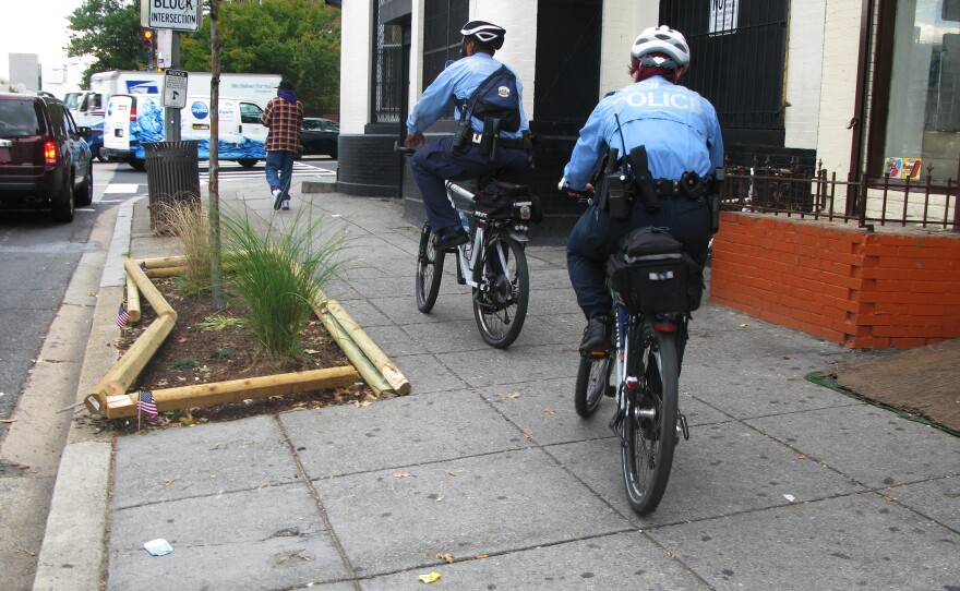 Police officers ride their bicycles in Washington, D.C. Sidewalk cycling is legal almost everywhere in the city, with the exception of the central business district.