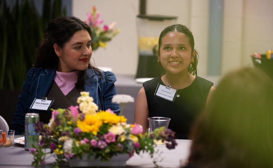 Mitzi Salgado (left), founder of the Transfronterizo Institute, listens to San Diego Mesa College student Isabella Barajas (right) at a KPBS community conversation on May 14, 2025.