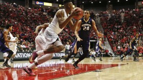 San Diego State forward Malik Pope steals a the ball as he heads up court against Washington forward Devenir Duruisseau during the first half of an NIT college basketball game in San Diego, March 21, 2016.