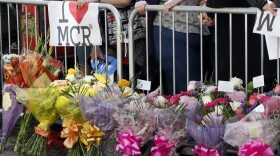 People attend a vigil in Albert Square, Manchester, England, May 23, 2017.