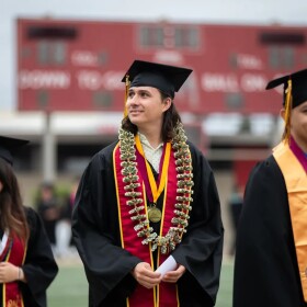 Graduating students walk into the DeVore Stadium during a commencement ceremony at Southwestern College in Chula Vista on May 24, 2024.
