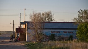 On the south side of Whiteclay, Neb., a crowd gathers outside one of the town's four liquor stores.