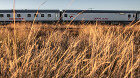 The Phelophepa health-care train on the outskirts of Thaba Nchu, South Africa. To alert patients that the train is coming, Transnet, the company that runs the Phelophepa, publishes a schedule for the year. And community mobilizers in each town make sure patients are aware of the train's arrival.