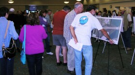 Community members poured over images of the proposed I-5 expansion at a CalTrans open house July 27.