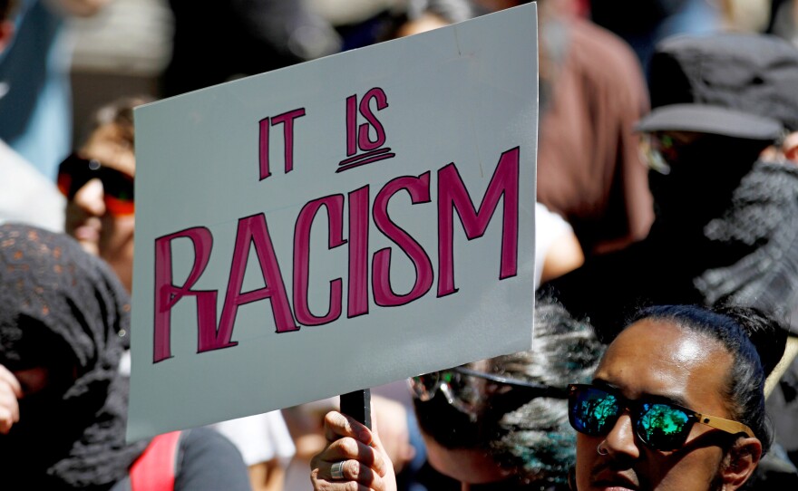 People protest against President Trump in San Francisco.