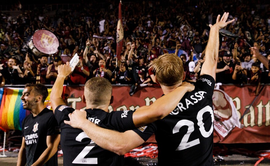 Sacramento Republic FC Players celebrate their U.S. Open semifinal overtime win against Sporting Kansas City in Sacramento, Calif.