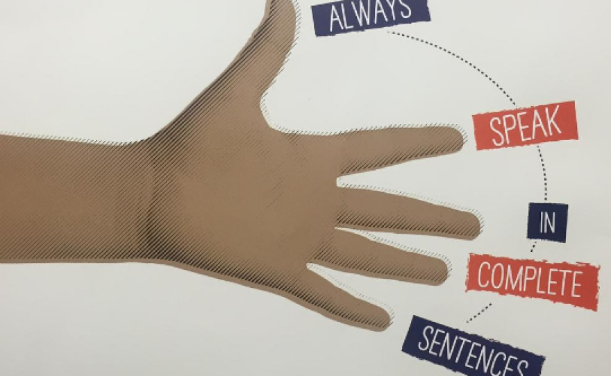 Posters encouraging students to speak in full sentences hang in the hallways at Kramer Elementary in Dallas.