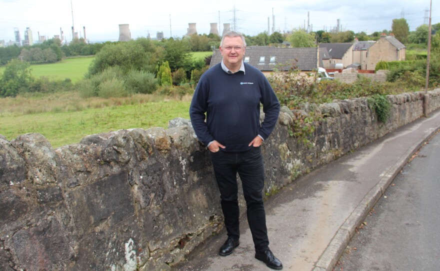 Kevin Ross, president of the Scottish Plastics and Rubber Association, in front of the INEOS Grangemouth refinery and chemical plant.