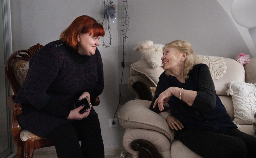 Svitlana Domoratska (left), a social worker in Sloviansk, Ukraine, visits and helps elderly Ukrainians like Liubov and Viktor Lada, who need help with getting prescriptions and food, and have been especially isolated since Russia's war began.