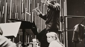 Jamie Bernstein watches her father, Leonard Bernstein, conduct the New York Philharmonic at a rehearsal for one of his Young People's Concerts, circa fall 1962.