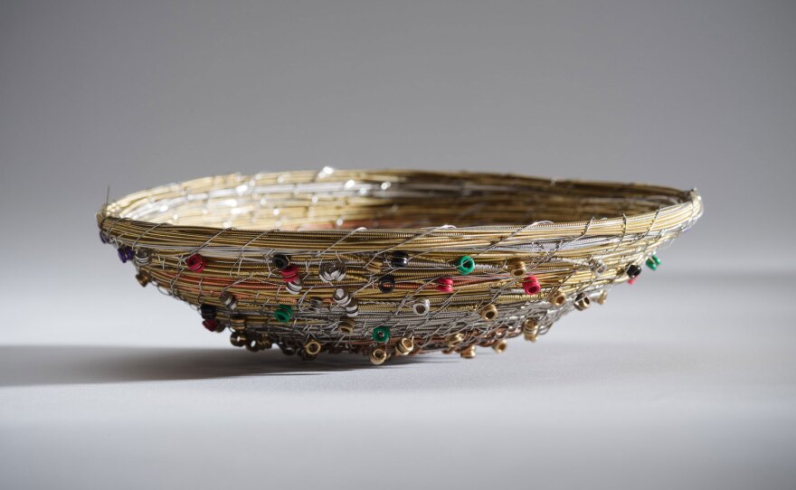 Tracy Lee Nelson's "Music Basket" is a work made of guitar strings, shown in a 2022 photo.