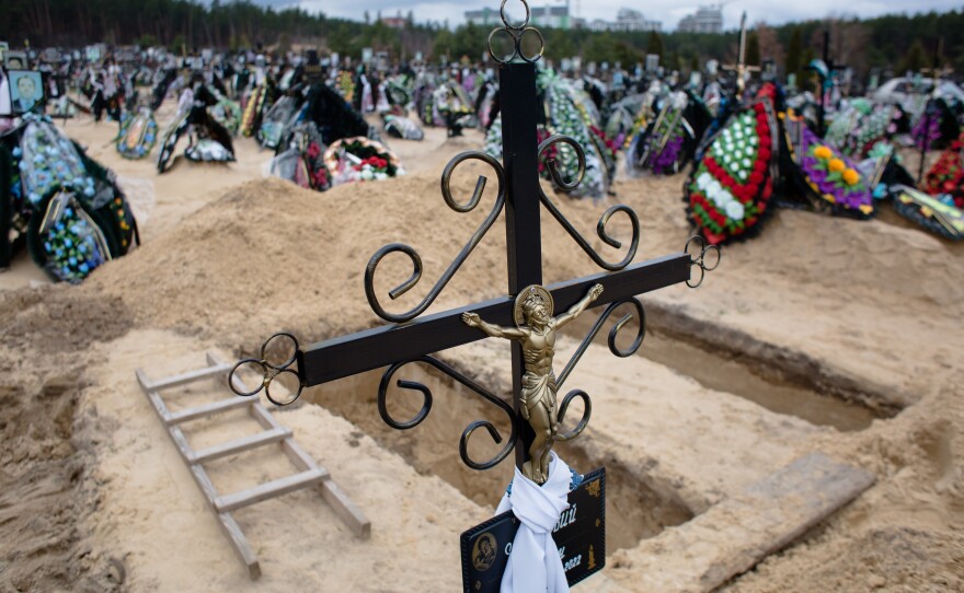 A view of newly dug graves at a cemetery in Bucha, Ukraine. The Russian retreat from northern Ukrainian towns and cities has revealed scores of civilian deaths.