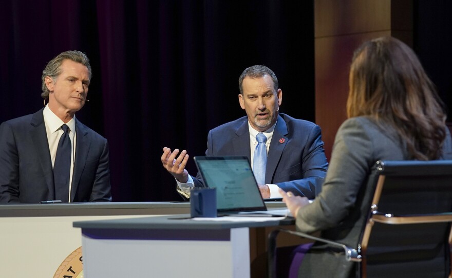 Republican gubernatorial candidate state Sen. Brian Dahle, second from left, responds to a question during a debate with Democratic Gov. Gavin Newsom, left, held by KQED Public Television in San Francisco on  Oct. 23, 2022.