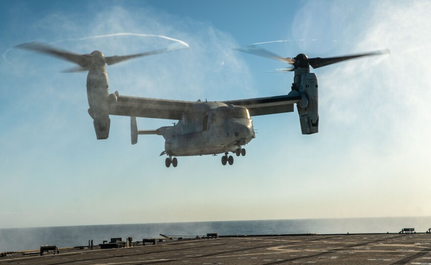 A U.S. Marine Corps MV-22B Osprey attached to Marine Medium Tiltrotor Squadron (VMM) 165, lands aboard the amphibious dock landing ship USS Harpers Ferry in the Pacific Ocean, Nov. 19, 2023.