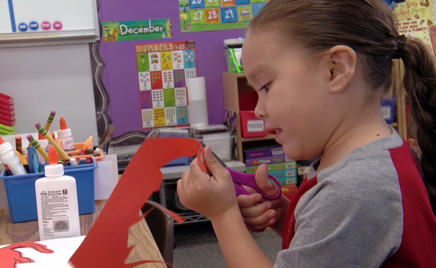 A child works in a transitional kindergarten classroom in Alpine, Nov. 29, 2022.