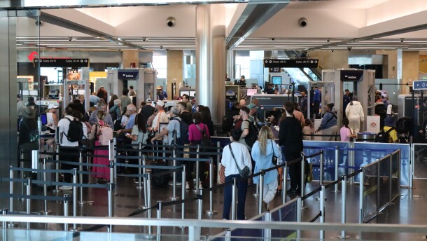 Passengers wait in the Terminal 2 security line at the San Diego International Airport on Monday, March 23, 2026.