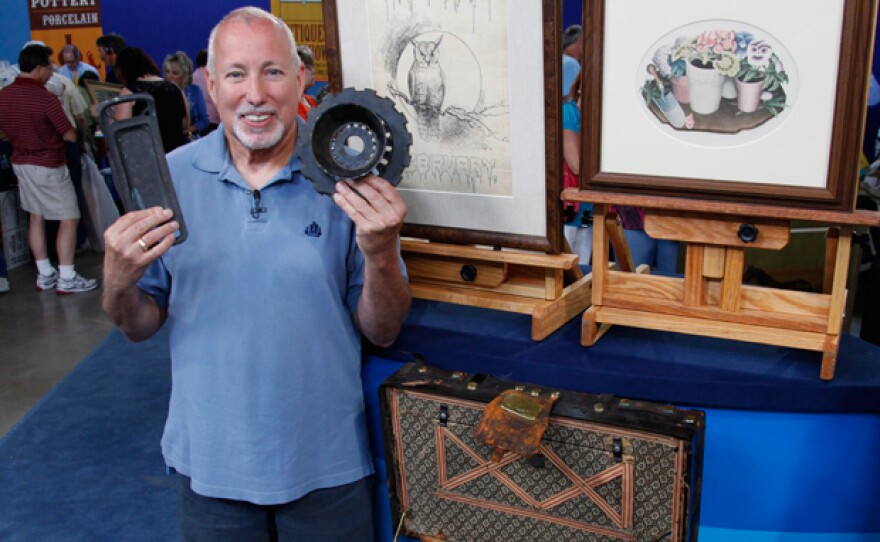At "Antiques Roadshow" in Des Moines, Iowa, this guest shows off his collection of Iowa native Grant Wood artwork and personal effects. Inherited from Wood’s aunt, the assortment includes a drawing and lithograph, as well as a trunk containing some of the iconic American artist’s possessions. Thrilled by the discovery, appraiser David Weiss offered an evaluation of $14,000 to $22,000.