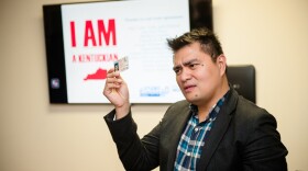 Pulitzer Prize-winning journalist Jose Antonio Vargas giving a lecture while holding California drivers license in this undated photo. 