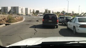 Cracked asphalt near the zoo off De Los Presidentes in Mexicali. The building to the left is the new Universidad Autónomo de Baja California building in Rio Nuevo. This photo was posted to TwitPic on April 4, 2010 via @r13639. 