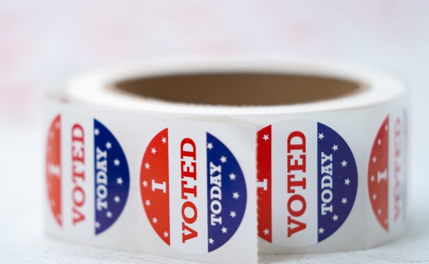 A roll of stickers reading "I voted today" sit on a table at a polling location in Summerville, S.C., during midterm primary elections on June 14, 2022.