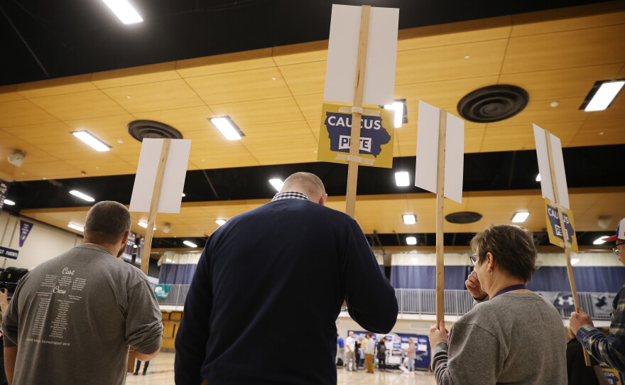 Supporters of then-Democratic presidential candidate Pete Buttigieg prepare to caucus for him in the gym of Roosevelt High School in Des Moines, Iowa, on Feb. 3, 2020. The caucuses were marred by issues and no winner was named.