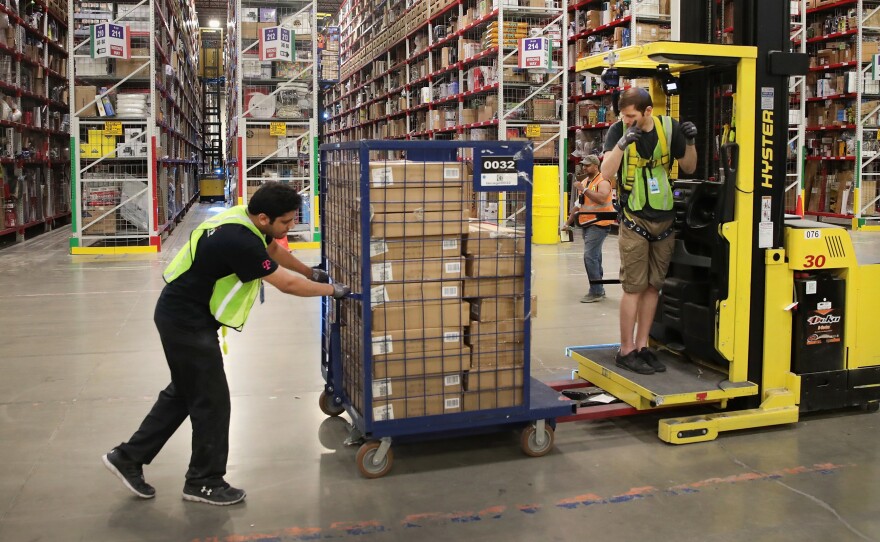 Amazon says it's planning to hire 100,000 U.S. workers to deal with increased demand during the coronavirus outbreak.