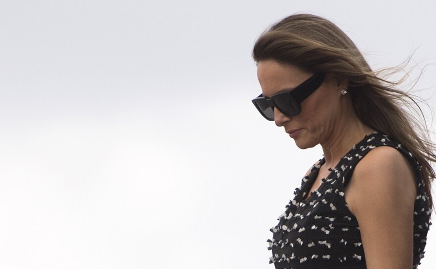First lady Melania Trump arrives in West Palm Beach, Fla., last week. On Wednesday, she reached a deal to settle defamation claims over an article published in the Daily Mail tabloid about her time as a model.