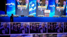 A video wall displays images of Benjamin Netanyahu with President Trump at a Likud party event before the release of the first exit poll results in Israel's general election, in Jerusalem, on Tuesday.