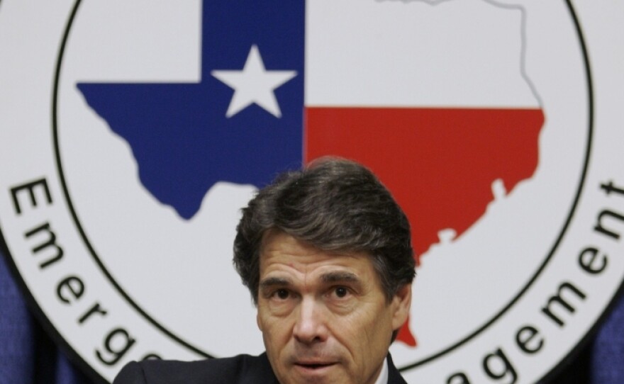 Texas Gov. Rick Perry answers questions following a speech at the Texas Homeland Security conference in San Antonio in 2006.