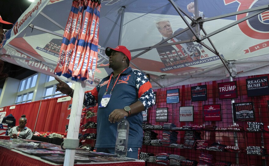 A booth selling hats and T-shirts is seen during the Conservative Political Action Conference, CPAC 2023, cheers during the session, at the National Harbor, in Oxon Hill, Md., Thursday, March 2, 2023.