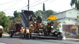 City crews repave Allied Road in San Diego's Allied Gardens neighborhood, Oct. 20, 2015.