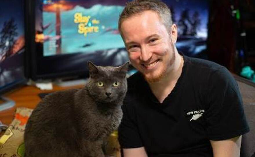 Stephen Flavall, or "jorbs" on Twitch, with his occasional co-star, Zephyr the cat.