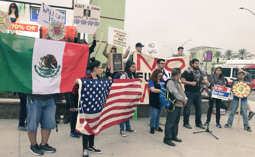 Protesters gather at the San Ysidro Port of Entry to speak out against President Donald Trump’s San Diego visit, March 13, 2018.