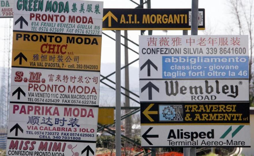 Street signs cater to the languages spoken in Prato.